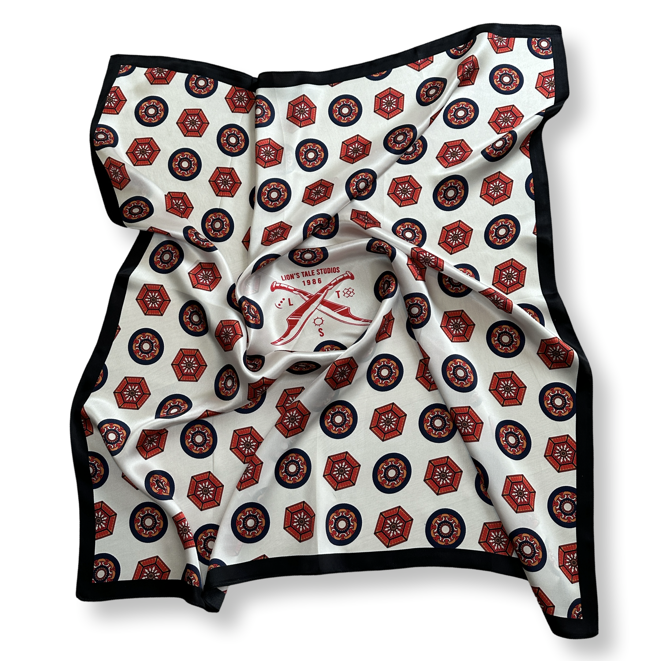 Tattooed female model wearing a 100% pure silk scarf by Lionâs Tale Studios â luxury babushka wrap with Moluccan ancestral symbols, cream and oxford blue design, hypoallergenic and breathable silk, styled for unisex minimalist fashion and heritage streetwear. Vrouwelijk model met tattoos draagt een 100% zijden sjaal van Lionâs Tale Studios â luxe babushka-stijl met Molukse symbolen, crĂšme en oxfordblauw ontwerp, hypoallergeen en ademend, geschikt voor uniseks mode en erfgoed-geĂŻnspireerde stijl.