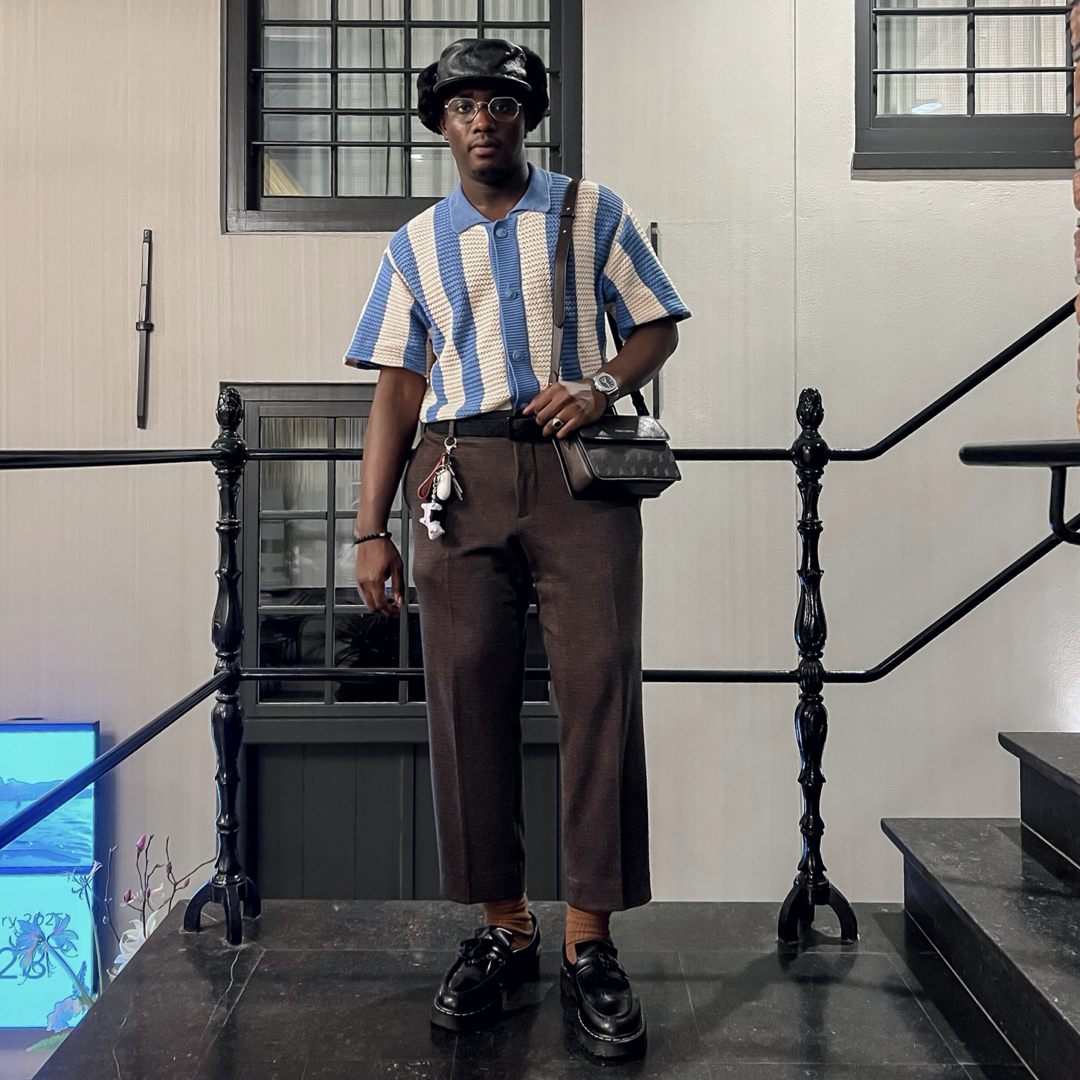 lion's tale studios knitwear knitted anti-logo no logo shirt light blue cream color button lion mena muria een voor allen voor een maluku molukken vertical stripes soft knit, breathable knitwear soft knit breathable knitwear cotton-blend quiet luxury, no-logo fashion, minimalist fashion Moluccan roots, heritage fashion, symbolic buttons unisex shirt, men’s knit shirt, women’s knitwear top cream and blue shirt, striped knit top, button-up knitwear designed in the Netherlands, sadat musty