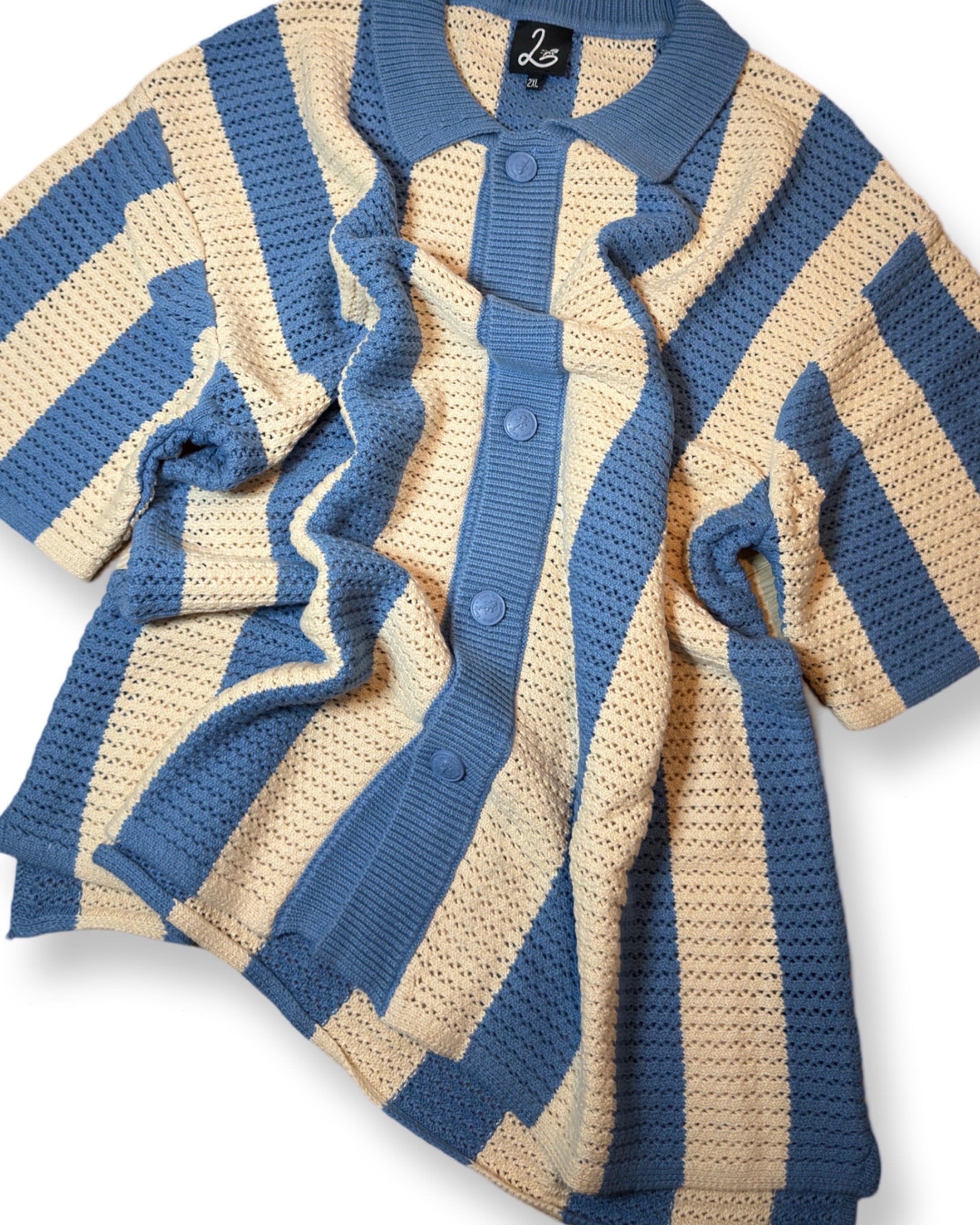 lion's tale studios knitwear knitted anti-logo no logo shirt light blue cream color button lion mena muria een voor allen voor een maluku molukken vertical stripes