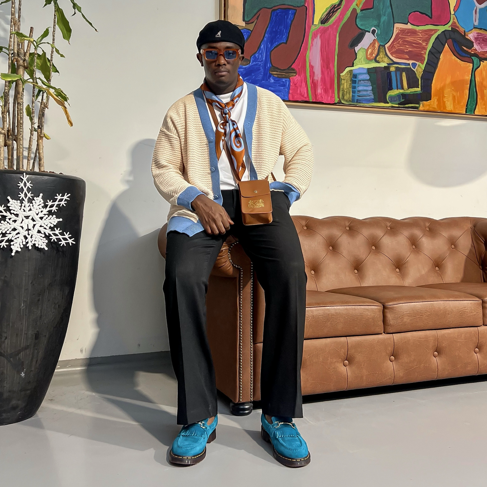 lion's tale studios knitwear knitted anti-logo no logo shirt light blue cream color button lion mena muria een voor allen voor een maluku molukken vertical stripes soft knit, breathable knitwear soft knit breathable knitwear cotton-blend quiet luxury, no-logo fashion, minimalist fashion Moluccan roots, heritage fashion, symbolic buttons unisex shirt, menâs knit shirt, womenâs knitwear top cream and blue shirt, sadat musty, button-up knitwear designed in the Netherlands, pure silk min bag leather