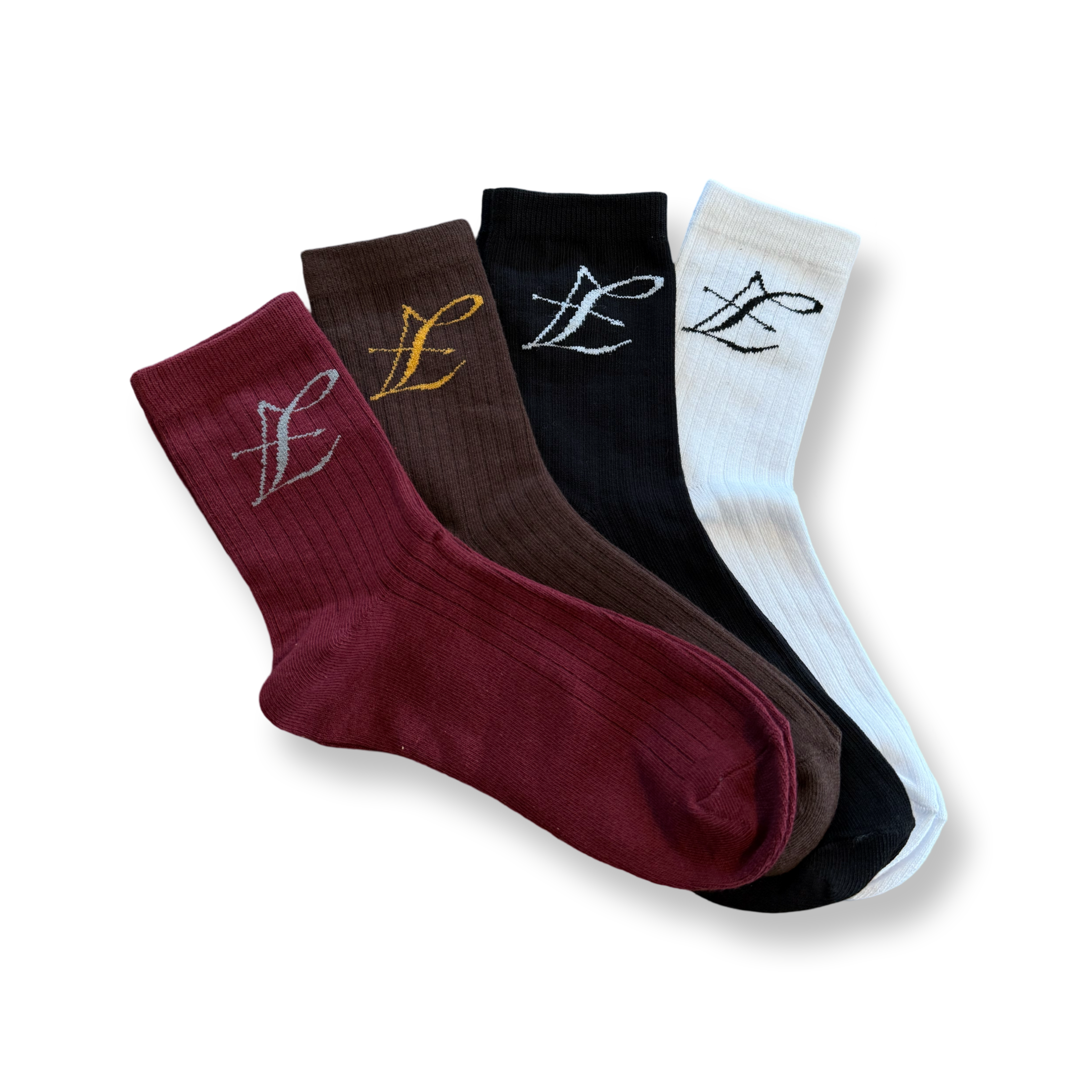 Luxe katoenen crew sokken van Lion's Tale Studios - halfhoge pasvorm, zachte badstof onderkant voor comfort en duurzaamheid, verkrijgbaar in 4 kleurstellingen met handtekening logodetails: wit, zwart, bruin en bordeaux. Luxe katoenen crew sokken van Lion's Tale Studios - halfhoge pasvorm met zachte terry zool voor comfort en duurzaamheid, verkrijgbaar in 4 kleuren met kenmerkend logo: wit, zwart, bruin en bordeaux.